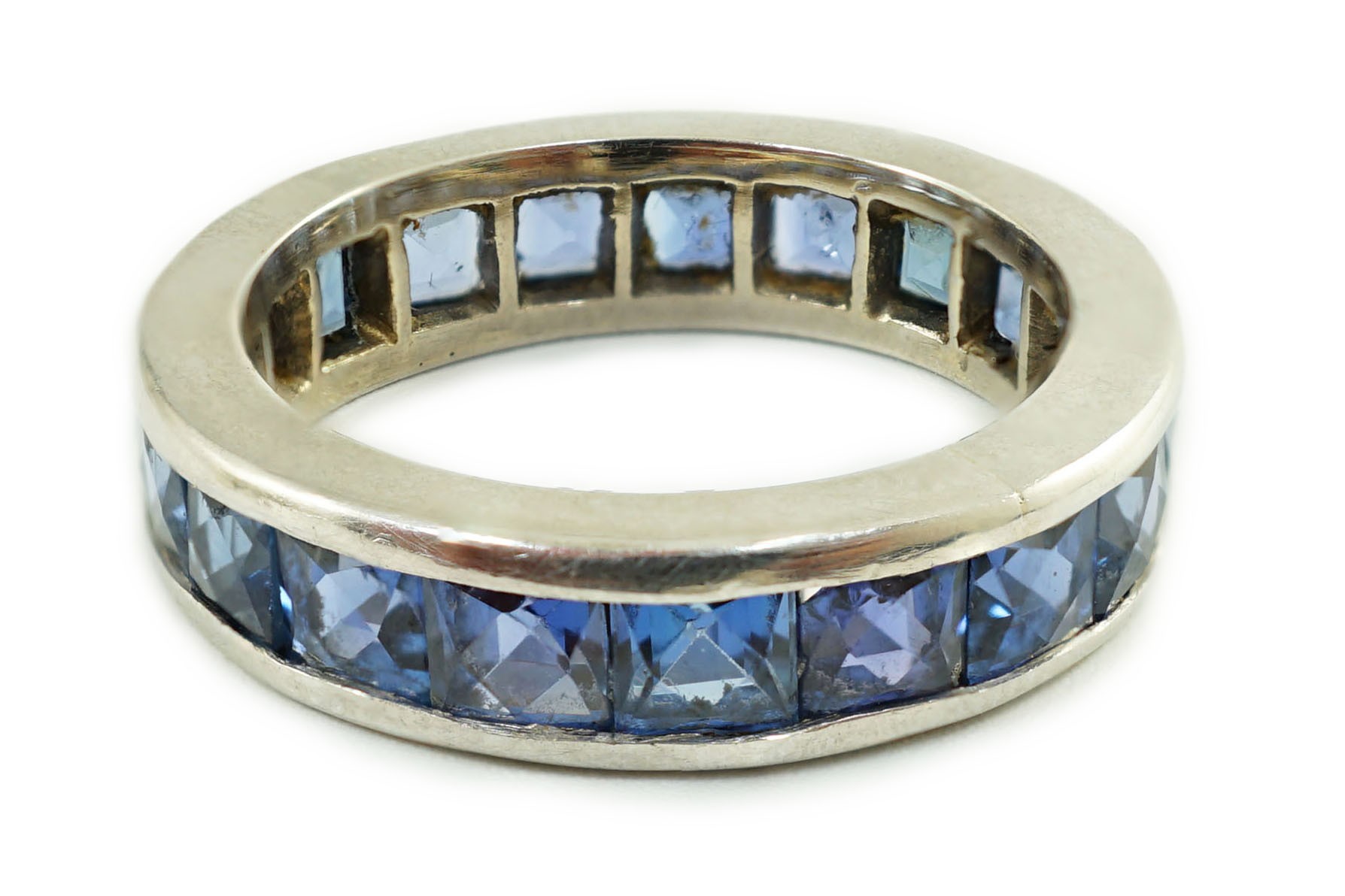 A platinum? and square cut sapphire set full eternity ring